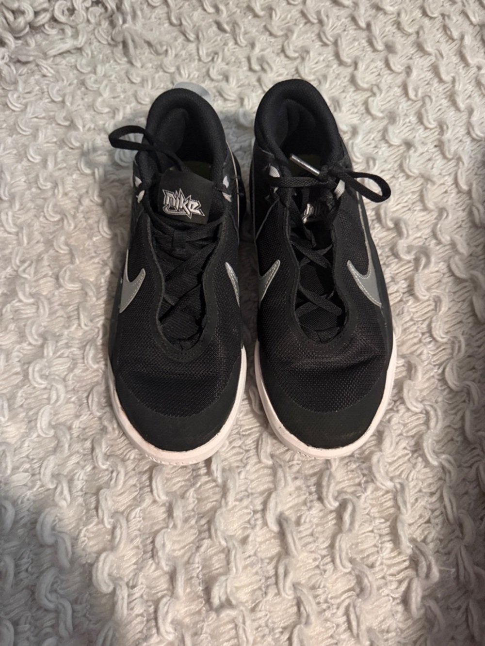 Nike Black Sneakers with Silver Swoosh